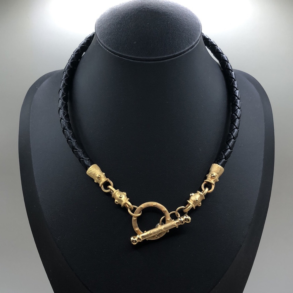 Corded leather collar necklace toggle clasp front pendant.
